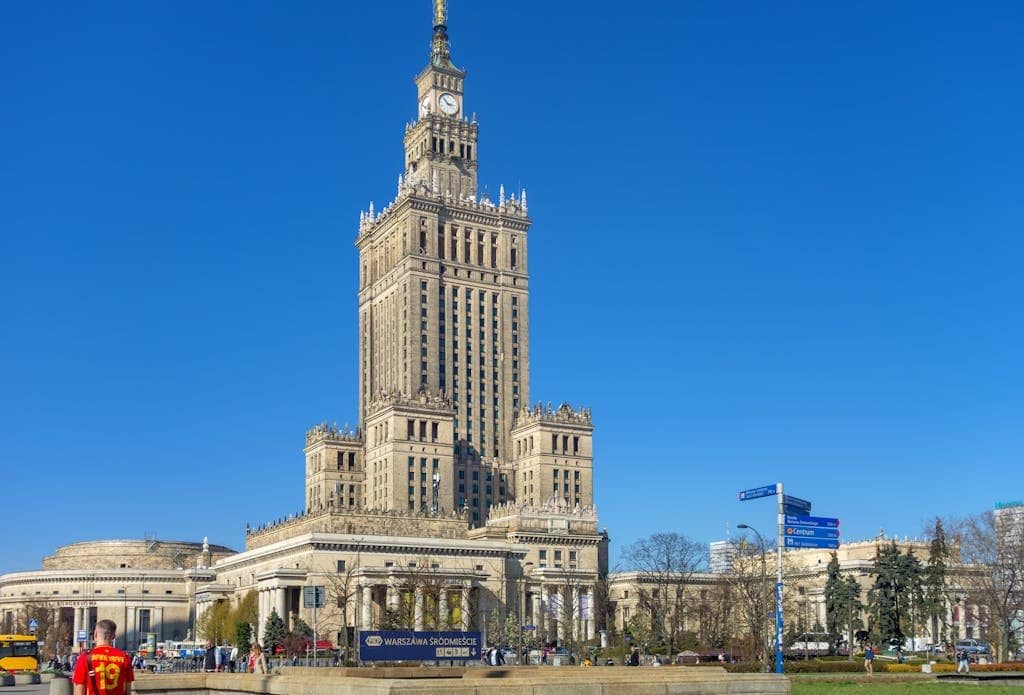 Palace of Culture and Science under a clear blue sky in Warsaw, Poland.