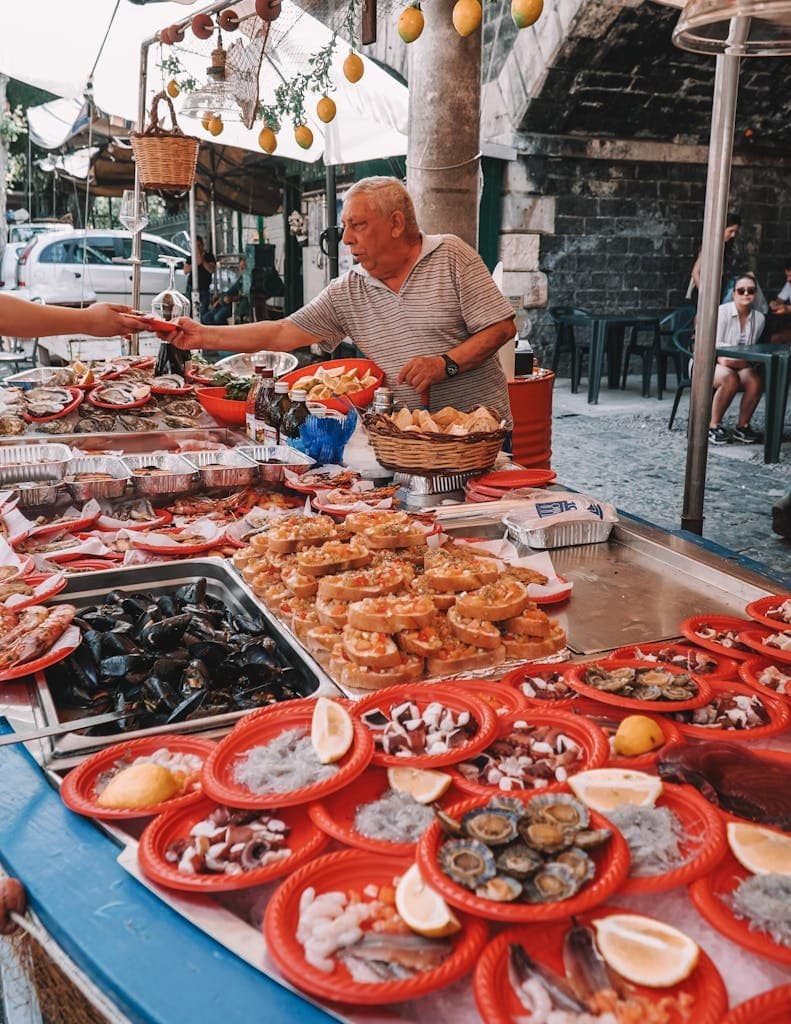 Vibrant display of seafood at a traditional Sicilian street market in Catania, Italy.